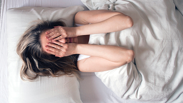 Photo of Woman having insomnia in bed